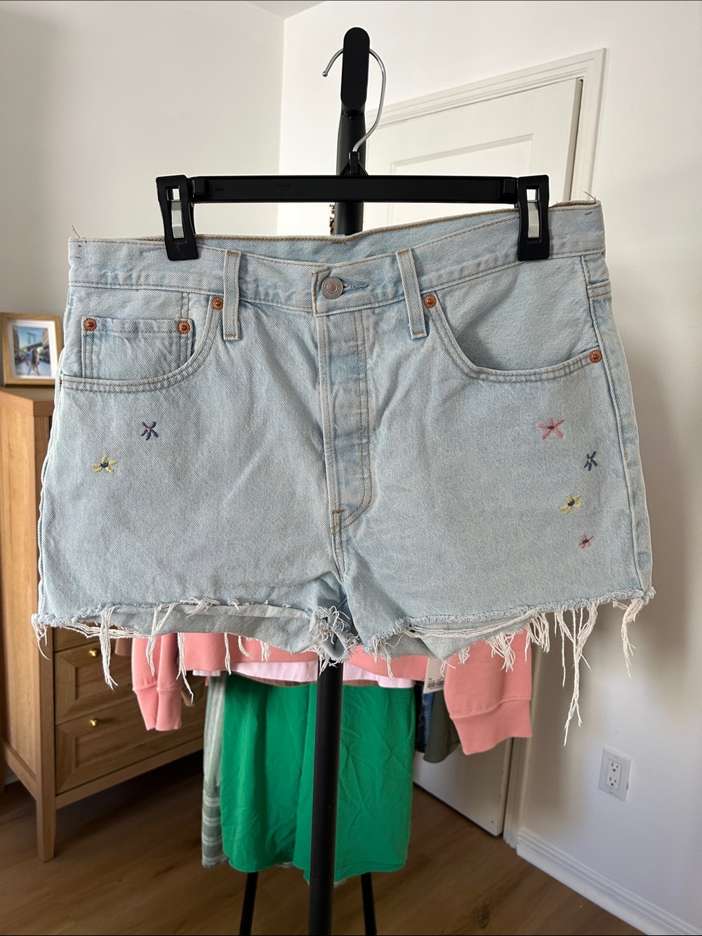 Levi’s 501 Distressed Jean Shorts. Size 32. 2.5” inseam. Cute embroidered detail
